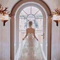 bride at Glenmere Mansion entrance